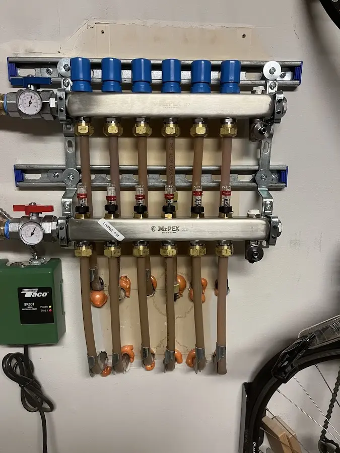 Plumber performing Water Heater Repair at a residential property in Caroline